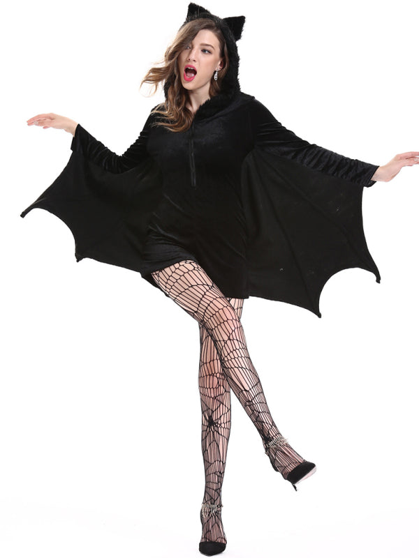 a woman dressed in a black bat costume