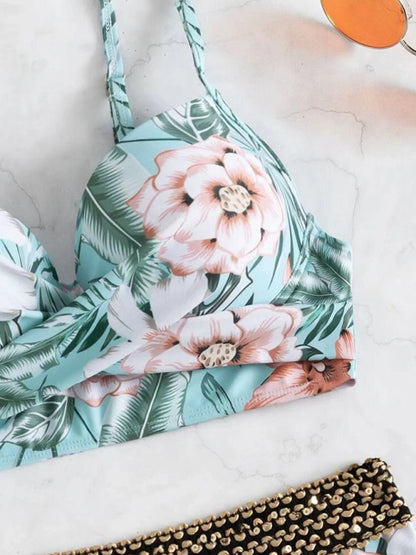 a bikini top with a flower print on it