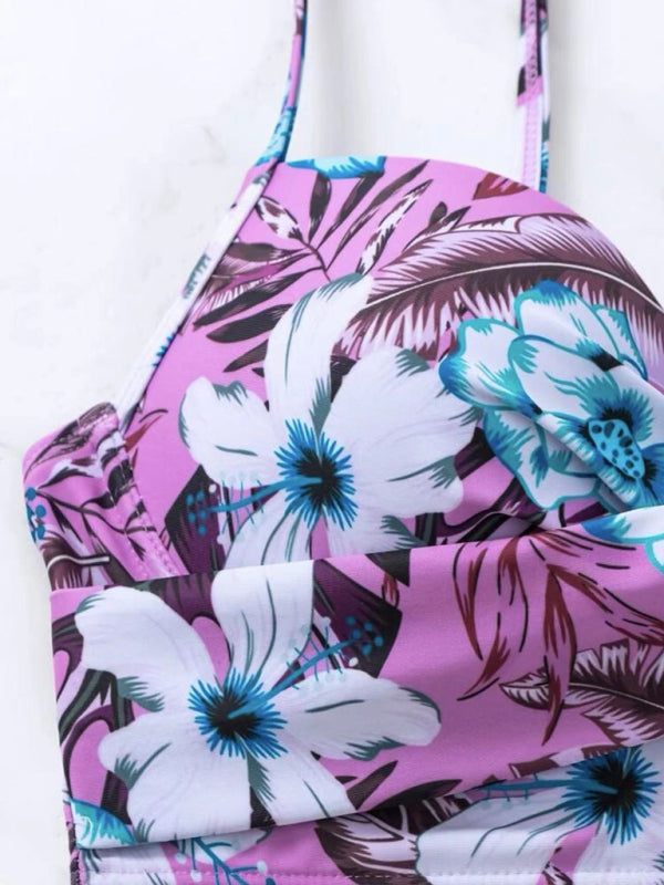 a close up of a pink and blue flowered bag