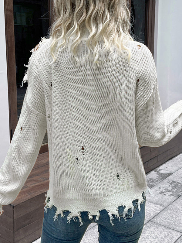 a woman standing on a sidewalk with her back to the camera