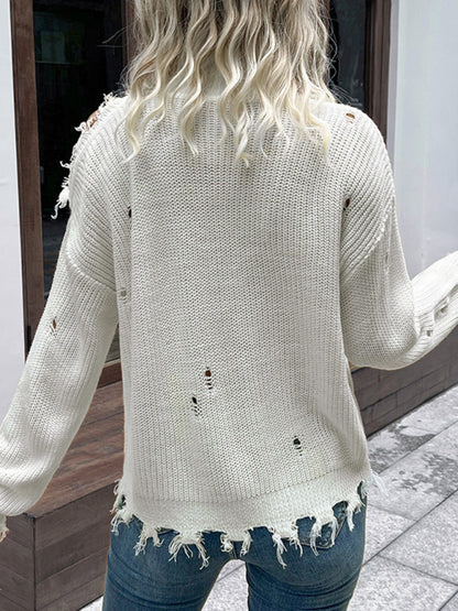 a woman standing on a sidewalk with her back to the camera