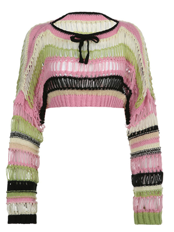 a pink sweater with black and white stripes