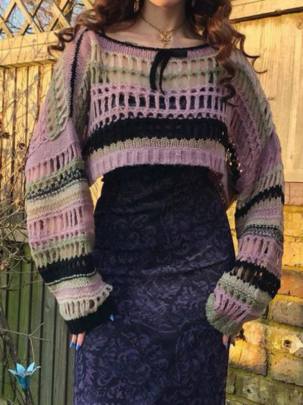 a woman standing in front of a wooden fence