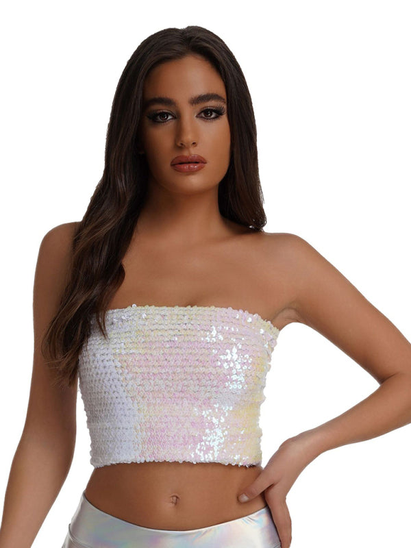 a woman wearing a white crop top with sequins