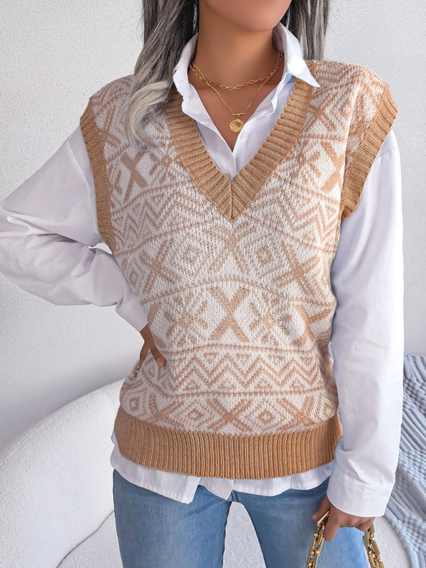 a woman wearing a sweater vest and jeans