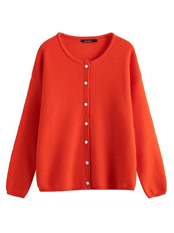 an orange cardigan sweater with buttons