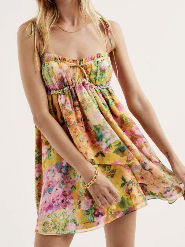 a woman in a floral dress posing for a picture