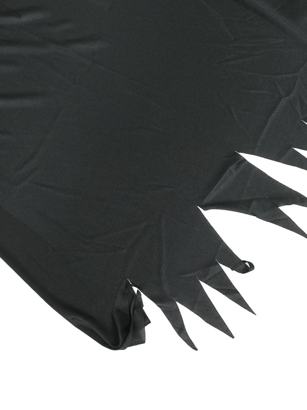 a close up of a black cloth with spikes on it