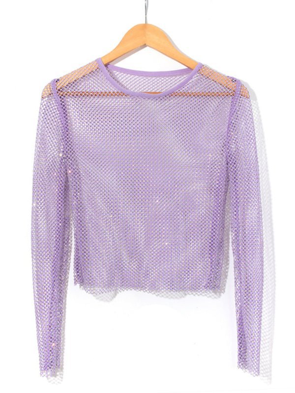 a purple top hanging on a wooden hanger