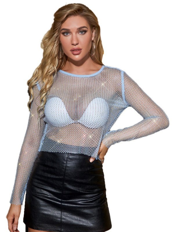 a woman wearing a fishnet top and leather skirt