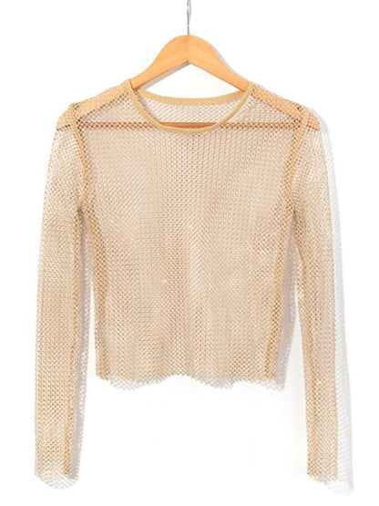 a white sweater hanging on a wooden hanger