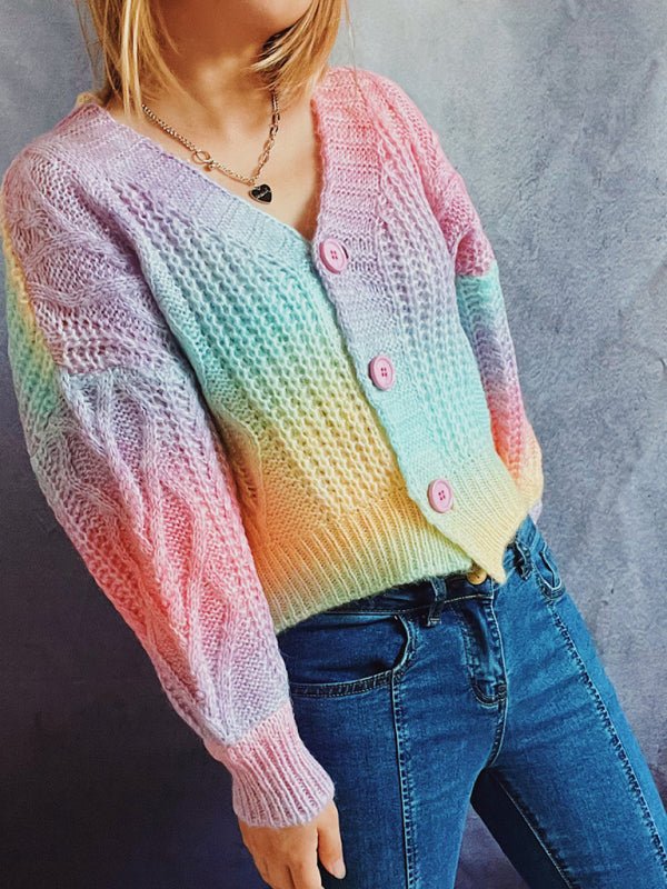 a woman wearing a colorful sweater and jeans