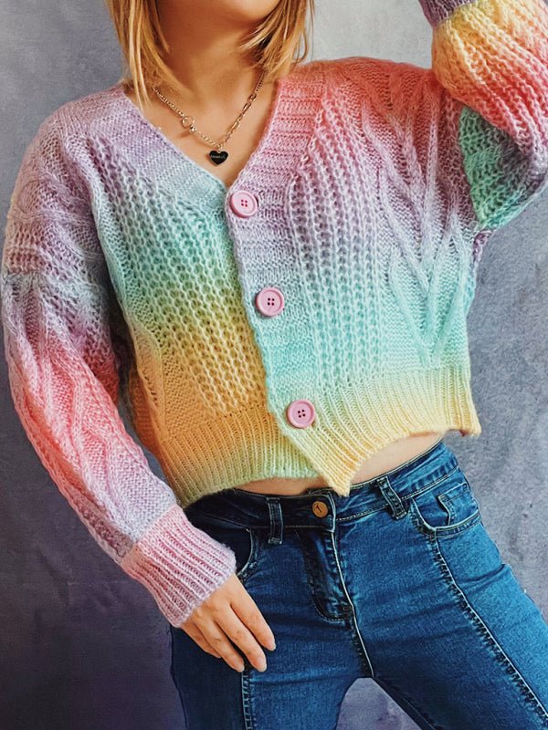 a woman wearing a colorful sweater and jeans