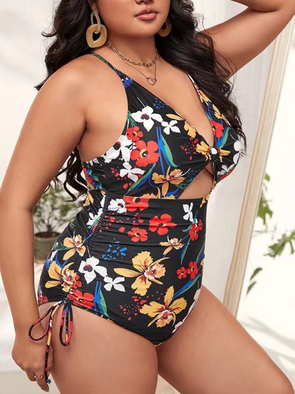 a woman in a floral print one piece swimsuit