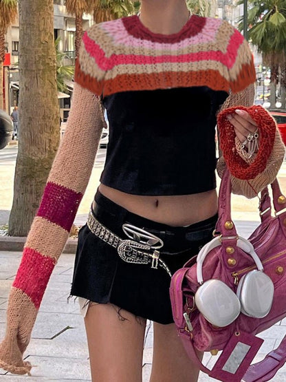 a woman walking down the street carrying a purse