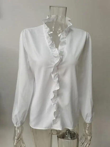 a white shirt with ruffles on a mannequin