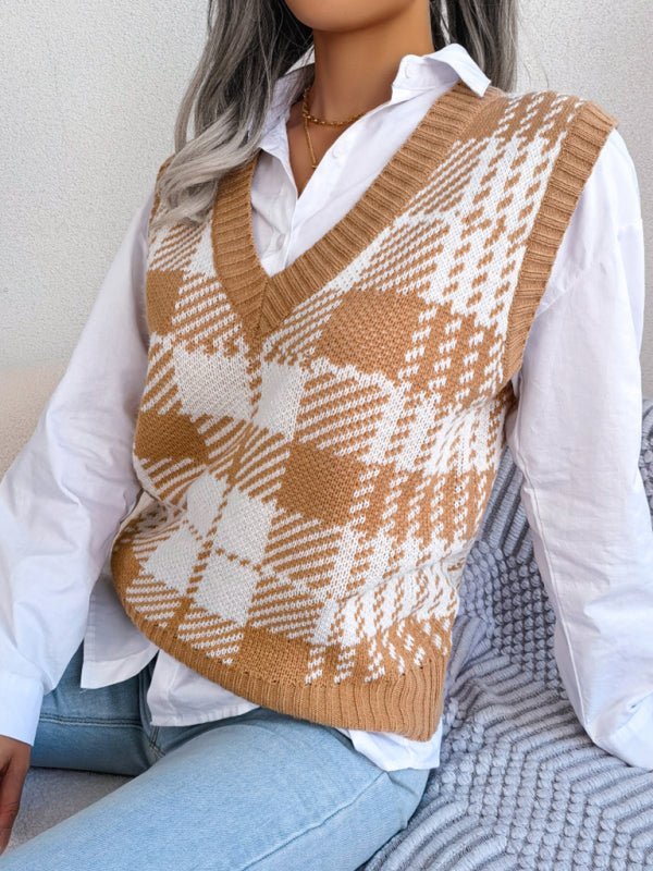 a woman sitting on a bed wearing a sweater vest