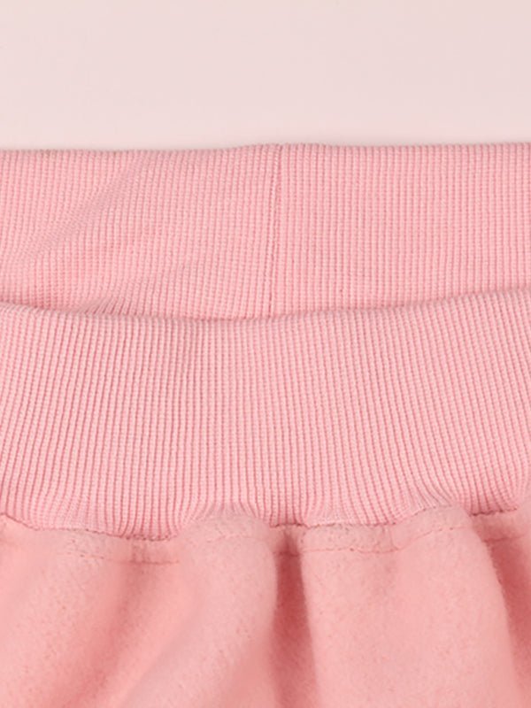 a close up of a pink skirt on a white background
