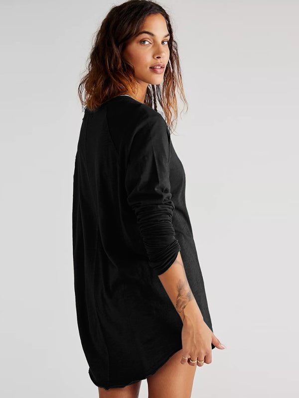 a woman wearing a black shirt dress