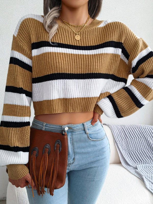 a woman wearing a striped sweater and jeans