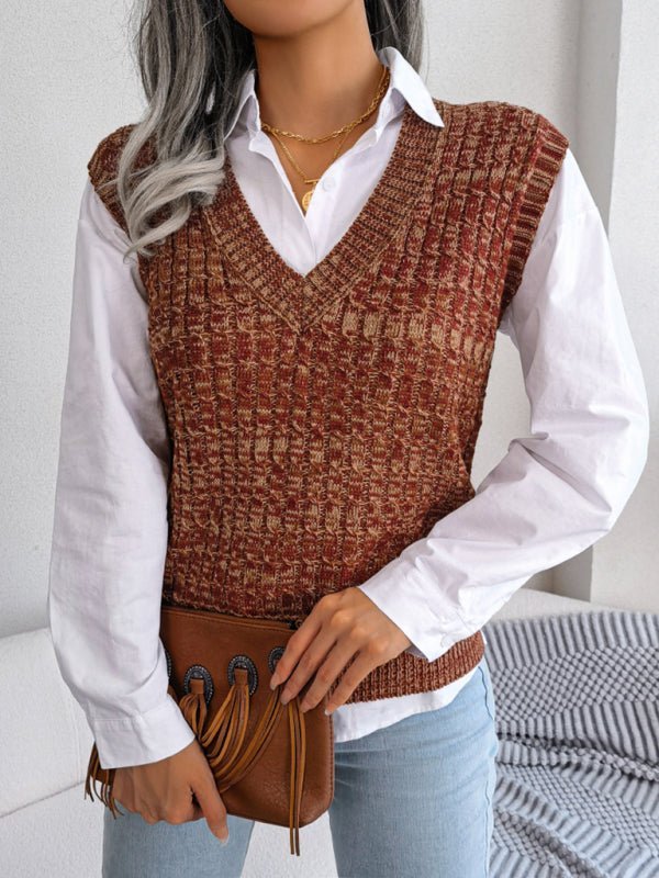 a woman with grey hair wearing a sweater vest