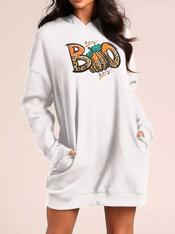 a woman wearing a white hoodie with the word boo on it