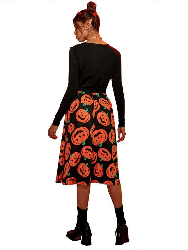 a woman wearing a skirt with pumpkins on it