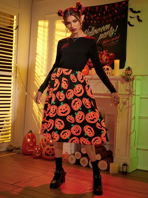a woman in a black dress with pumpkins on it