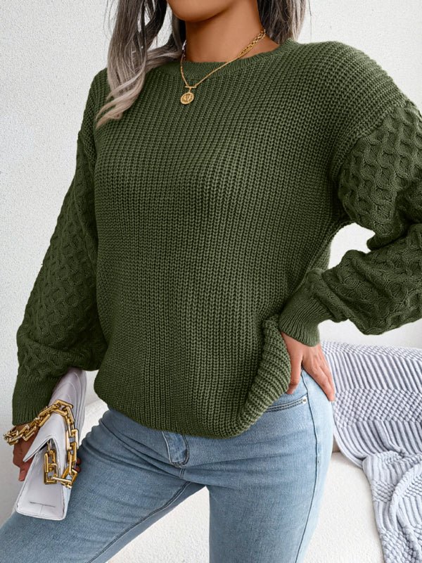 a woman wearing a green sweater and jeans