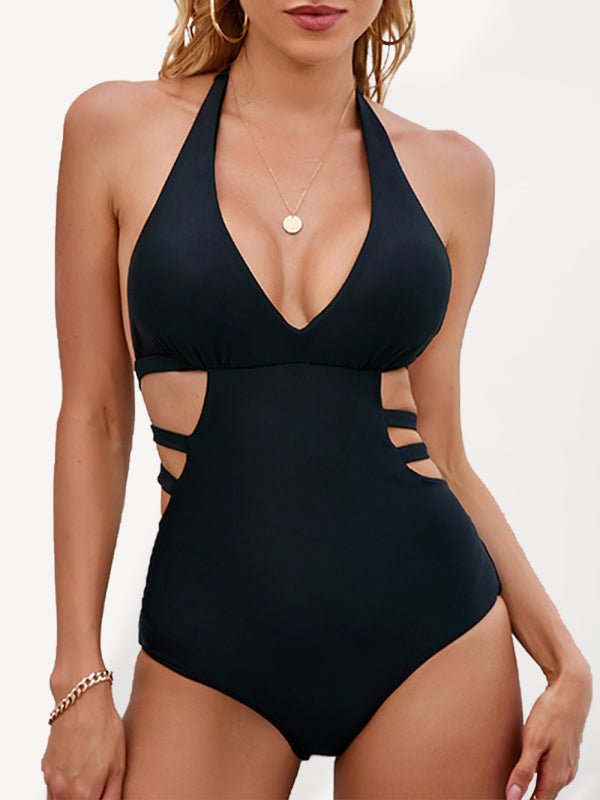 a woman in a black one piece swimsuit