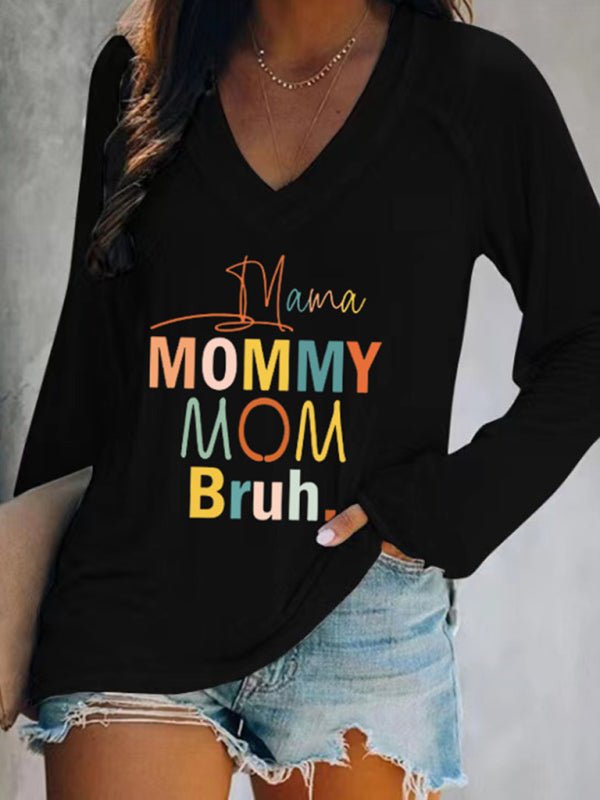 a woman wearing a black shirt that says mommy mom brun
