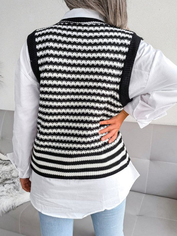 a woman wearing a black and white sweater vest
